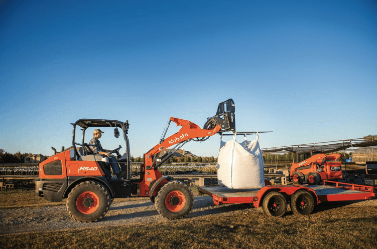 Wheel Loader loading a trailer with materials