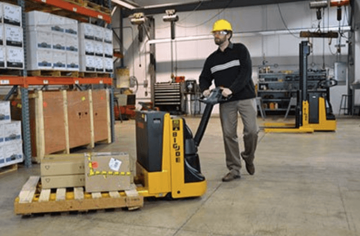 Man using Pallet Jack in a warehouse