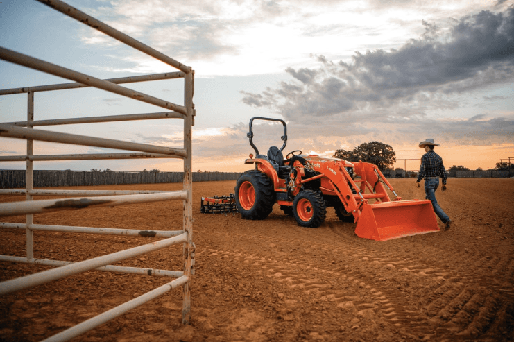 Man walking towards a tractor