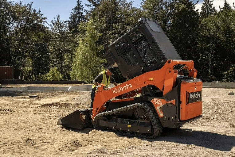 Man walking into a Track Loader