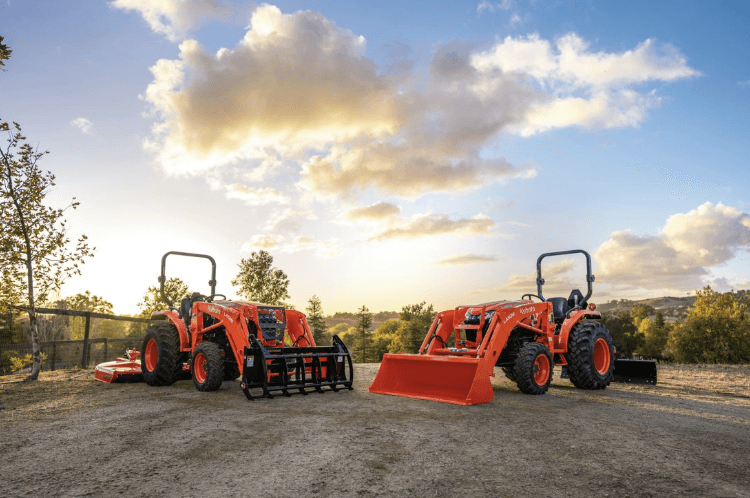 Compact Tractors out in front of scenic fields