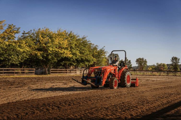 Man using Compact Tractor to plow