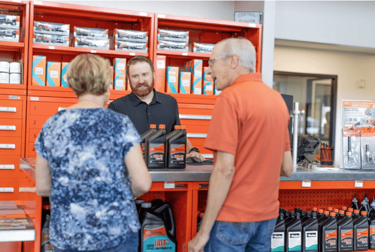 Parts employee consulting with cutomers